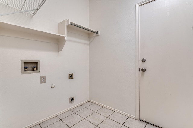 washroom with hookup for an electric dryer, hookup for a washing machine, gas dryer hookup, light tile patterned floors, and baseboards