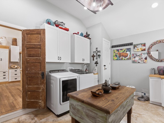 laundry area featuring cabinet space, independent washer and dryer, and baseboards