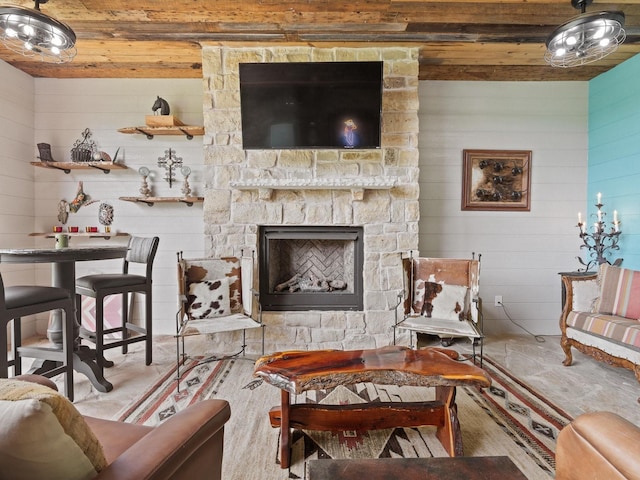 living room featuring wooden ceiling and a fireplace
