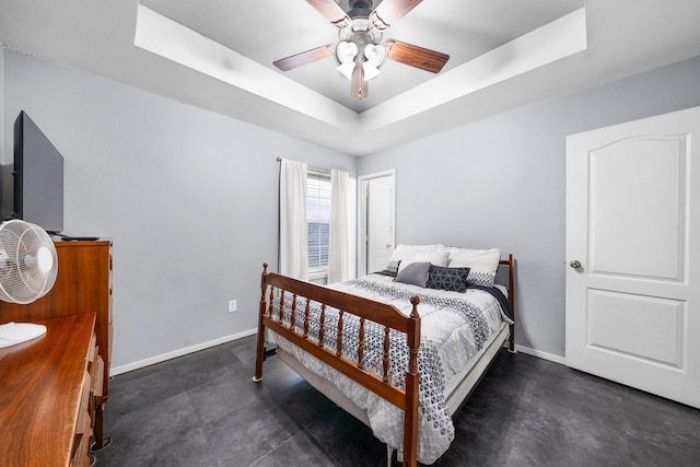 400 Houston St, Sulphur Springs, TX 75482 - bedroom featuring a raised ceiling, baseboards, and a ceiling fan