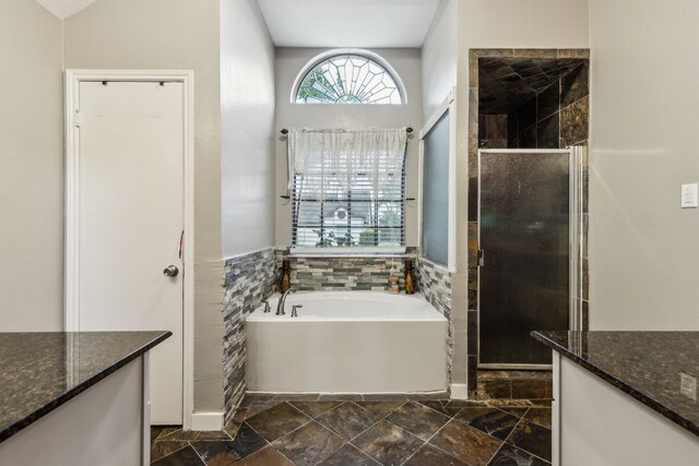 400 Crooked Ln, Mesquite, TX 75149 - bathroom with a stall shower, a bath, and vanity