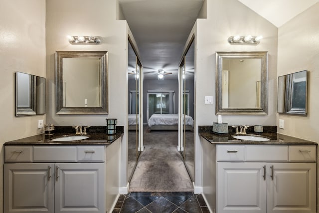 400 Crooked Ln, Mesquite, TX 75149 - bathroom with two vanities, ensuite bathroom, and baseboards