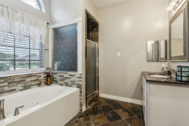 400 Crooked Ln, Mesquite, TX 75149 - bathroom featuring baseboards, a garden tub, a stall shower, and vanity