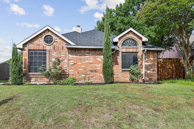 400 Crooked Ln, Mesquite, TX 75149 - view of front facade featuring brick siding, a chimney, and roof with shingles