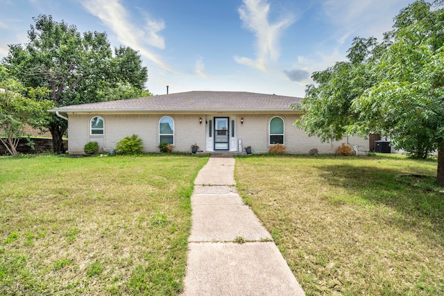 1426 Northridge Dr, Carrollton, TX 75006 - ranch-style house with a front lawn, brick siding, and a shingled roof