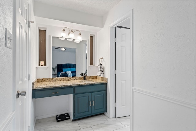 1426 Northridge Dr, Carrollton, TX 75006 - ensuite bathroom featuring vanity, a textured ceiling, and marble finish floors