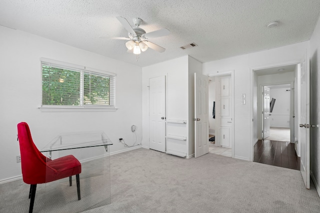 1426 Northridge Dr, Carrollton, TX 75006 - unfurnished room featuring carpet flooring, ceiling fan, a textured ceiling, and baseboards