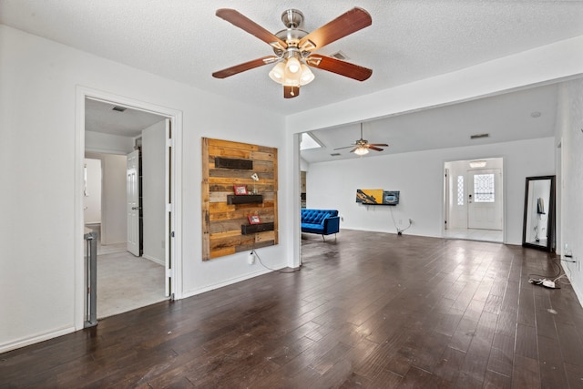 1426 Northridge Dr, Carrollton, TX 75006 - unfurnished living room with a ceiling fan, wood finished floors, and baseboards