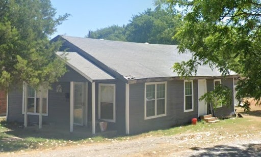 rear view of house featuring entry steps