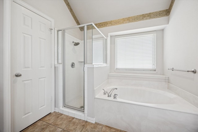 full bath featuring a stall shower, a garden tub, and tile patterned floors
