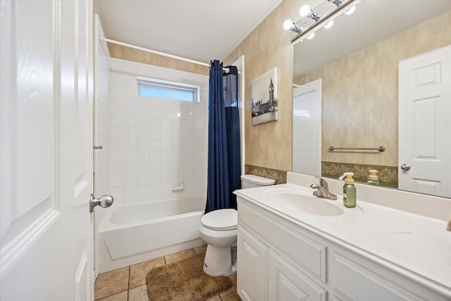 bathroom featuring toilet, vanity, shower / tub combo with curtain, and tile patterned flooring