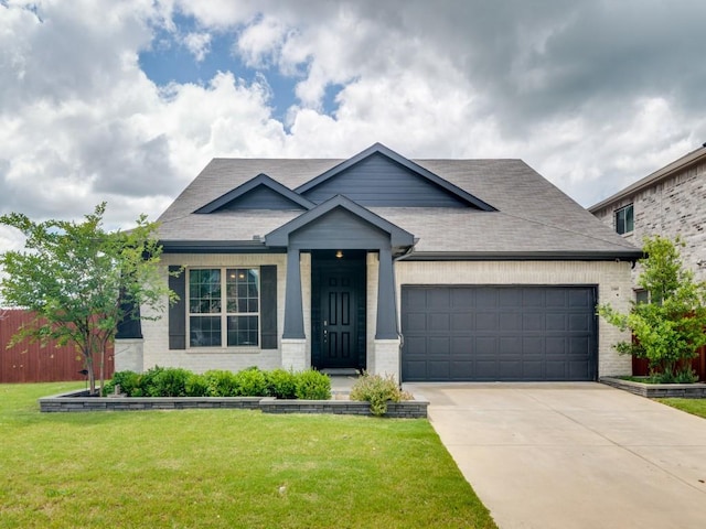 3305 Brentwood Cv, Forney, TX 75126 - view of front of property with brick siding, an attached garage, driveway, and roof with shingles