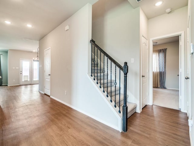 3305 Brentwood Cv, Forney, TX 75126 - staircase featuring wood finished floors, baseboards, recessed lighting, and a chandelier