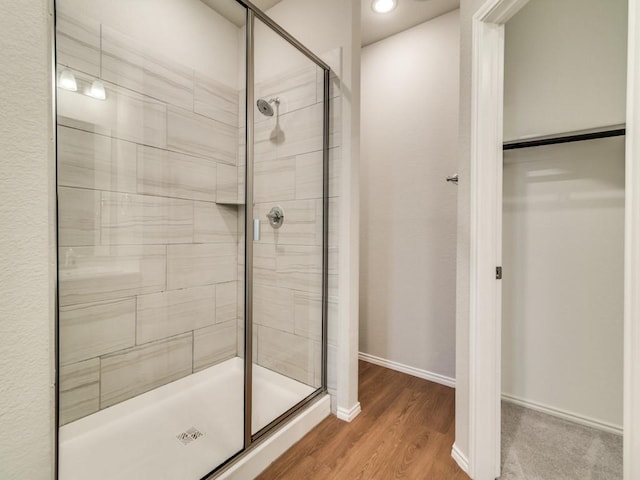 3305 Brentwood Cv, Forney, TX 75126 - full bathroom featuring a stall shower, wood finished floors, recessed lighting, and baseboards