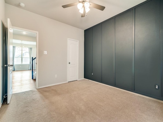 3305 Brentwood Cv, Forney, TX 75126 - empty room featuring light colored carpet, ceiling fan, a smoke detector, and baseboards