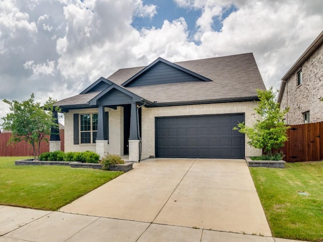 3305 Brentwood Cv, Forney, TX 75126 - craftsman-style house featuring an attached garage, brick siding, driveway, and roof with shingles