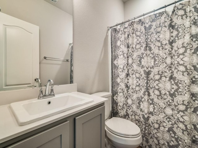 3305 Brentwood Cv, Forney, TX 75126 - full bathroom featuring toilet, vanity, and a shower with curtain