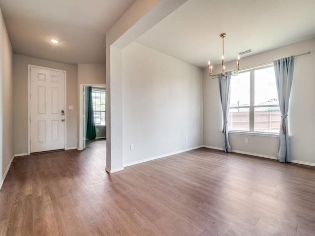 3305 Brentwood Cv, Forney, TX 75126 - empty room featuring a chandelier, wood finished floors, baseboards, and recessed lighting