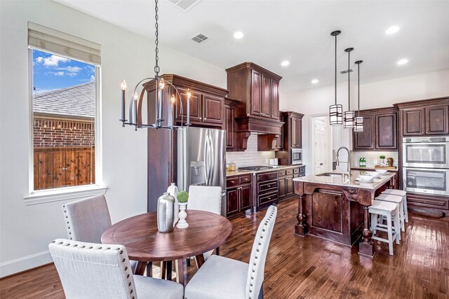 901 Clear Water Dr, Allen, TX 75013 - dining area featuring dark wood-style flooring, a chandelier, wine cooler, recessed lighting, and baseboards