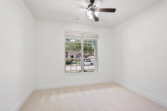 901 Clear Water Dr, Allen, TX 75013 - spare room featuring baseboards, a ceiling fan, and light colored carpet