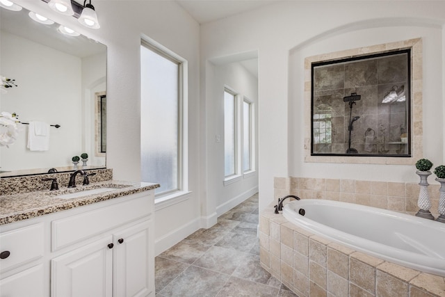 901 Clear Water Dr, Allen, TX 75013 - full bath featuring a bath, tiled shower, and vanity