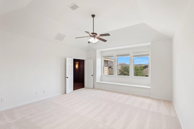 901 Clear Water Dr, Allen, TX 75013 - spare room featuring light colored carpet, a ceiling fan, baseboards, and vaulted ceiling