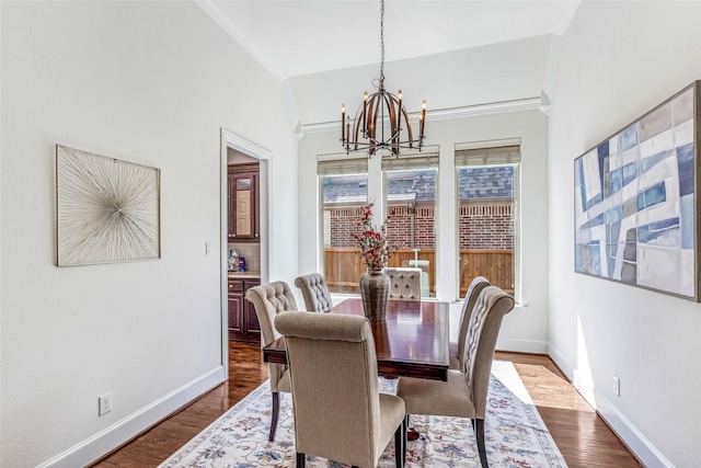 901 Clear Water Dr, Allen, TX 75013 - dining room with a chandelier, crown molding, dark wood-style floors, and baseboards