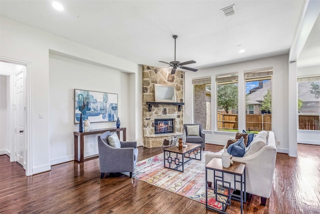 901 Clear Water Dr, Allen, TX 75013 - living area featuring ceiling fan, wood finished floors, a stone fireplace, baseboards, and recessed lighting