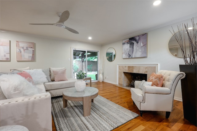 5820 Forest Ln, Dallas, TX 75230 - living room with crown molding, light wood-style flooring, recessed lighting, a premium fireplace, and ceiling fan