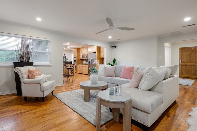 5820 Forest Ln, Dallas, TX 75230 - living area with ceiling fan, ornamental molding, light wood finished floors, recessed lighting, and baseboards