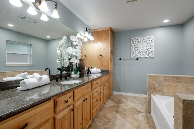 5820 Forest Ln, Dallas, TX 75230 - bathroom featuring double vanity, a garden tub, baseboards, and recessed lighting