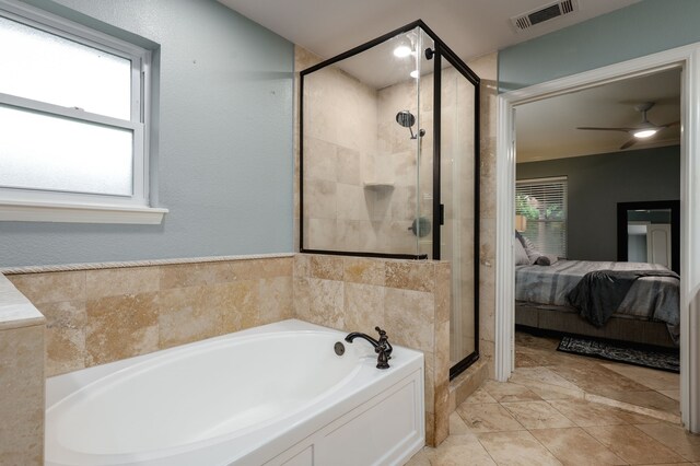 5820 Forest Ln, Dallas, TX 75230 - ensuite bathroom featuring a bath, a stall shower, a ceiling fan, and tile patterned flooring