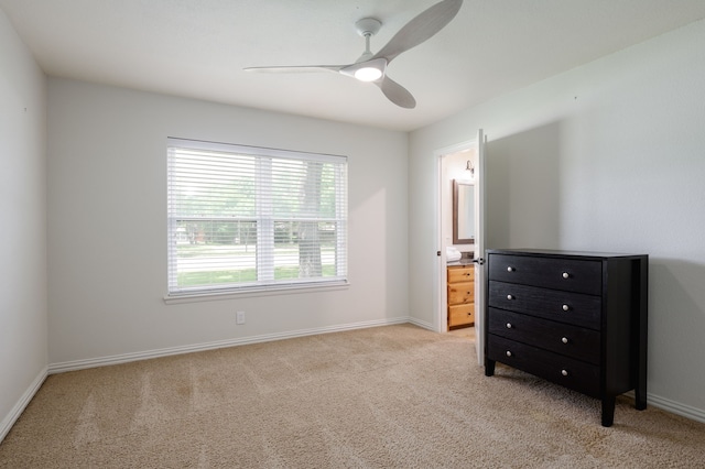 5820 Forest Ln, Dallas, TX 75230 - bedroom featuring light colored carpet, baseboards, ensuite bath, and a ceiling fan