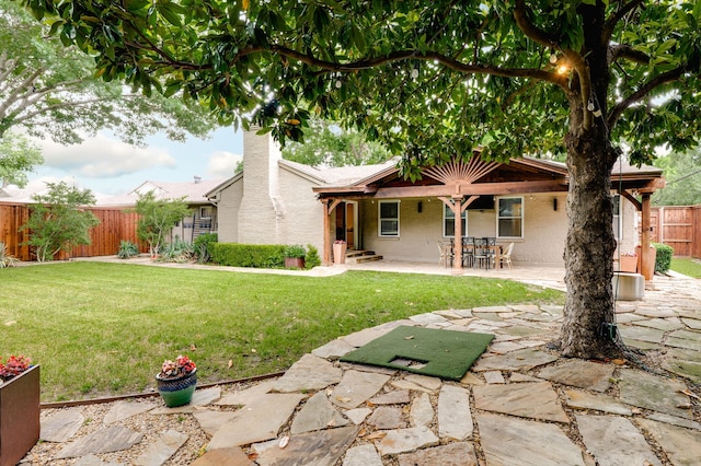 5820 Forest Ln, Dallas, TX 75230 - rear view of property with a patio, a chimney, and brick siding