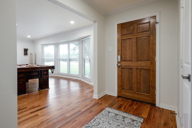 5820 Forest Ln, Dallas, TX 75230 - foyer entrance with wood finished floors, ornamental molding, recessed lighting, and baseboards