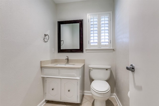 10101 Apple Creek Dr, Dallas, TX 75243 - half bathroom with toilet, tile patterned floors, baseboards, and vanity