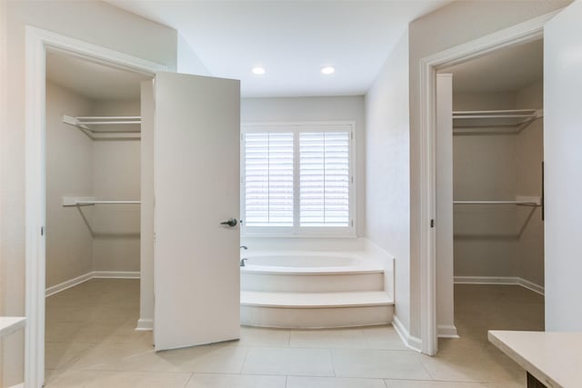 10101 Apple Creek Dr, Dallas, TX 75243 - bathroom featuring a garden tub, baseboards, tile patterned floors, recessed lighting, and a spacious closet
