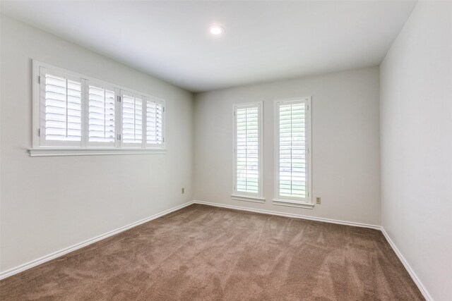 10101 Apple Creek Dr, Dallas, TX 75243 - carpeted spare room featuring plenty of natural light, baseboards, and recessed lighting