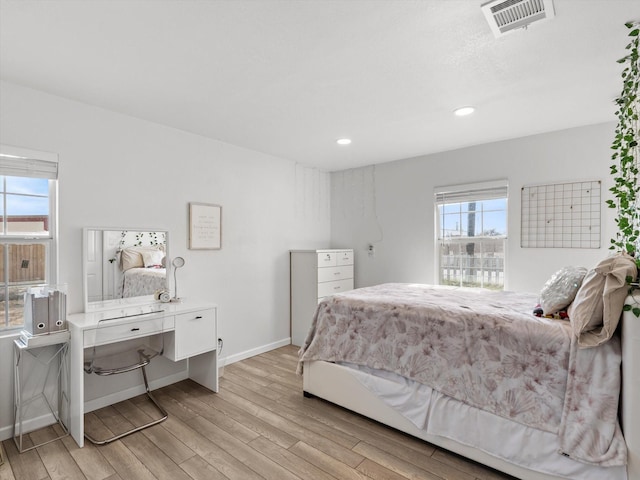 3939 Ermis St, Haltom City, TX 76111 - bedroom featuring light wood-style flooring, baseboards, and recessed lighting