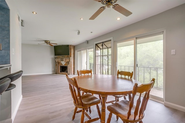 390 Driftwood Ct Unit 3B-1, Azle, TX 76020 - dining area with ceiling fan, baseboards, a fireplace, recessed lighting, and wood finished floors