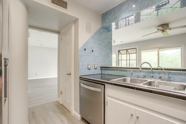 390 Driftwood Ct Unit 3B-1, Azle, TX 76020 - kitchen with dishwasher, light wood finished floors, white cabinets, dark countertops, and a sink