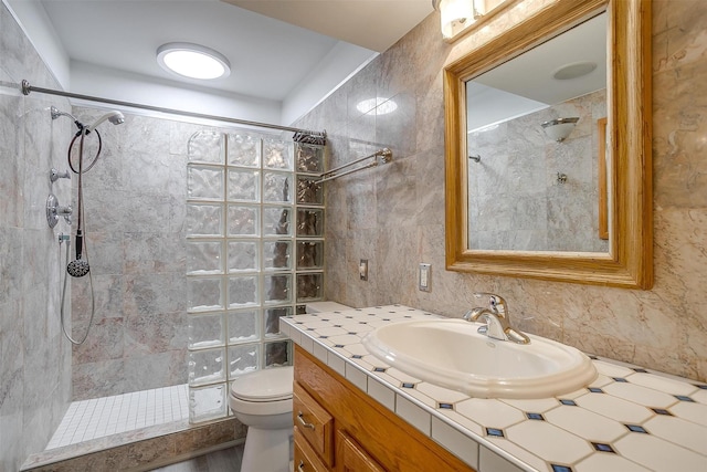 390 Driftwood Ct Unit 3B-1, Azle, TX 76020 - bathroom featuring tiled shower, toilet, vanity, and tile walls