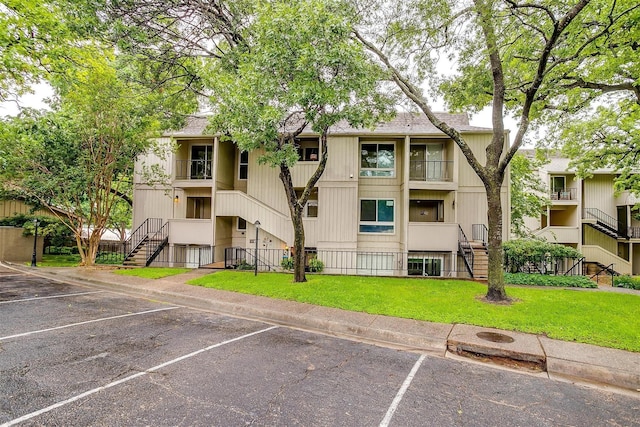 390 Driftwood Ct Unit 3B-1, Azle, TX 76020 - view of property featuring stairs and uncovered parking