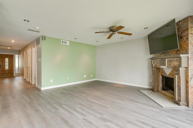 390 Driftwood Ct Unit 3B-1, Azle, TX 76020 - unfurnished living room with light wood-style floors, ceiling fan, baseboards, and recessed lighting