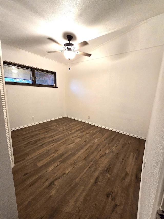 2804 Lynn Dell Dr, Tool, TX 75143 - unfurnished bedroom with dark wood-type flooring, a ceiling fan, and a textured ceiling