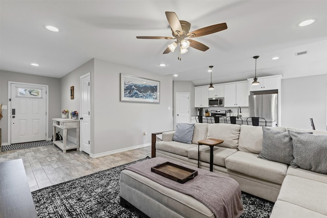 2104 Shane Ave, Fort Worth, TX 76134 - bathroom featuring wood finished floors, baseboards, vanity, toilet, and combined bath / shower with glass door