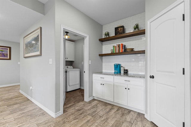2104 Shane Ave, Fort Worth, TX 76134 - bar area featuring tasteful backsplash, light wood-type flooring, baseboards, and separate washer and dryer