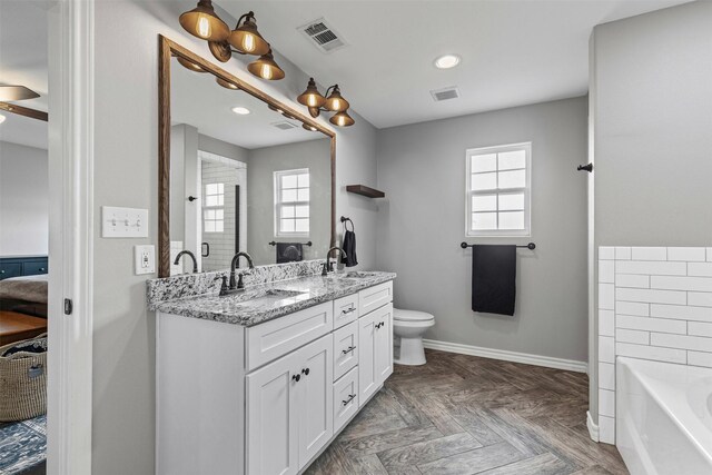 2104 Shane Ave, Fort Worth, TX 76134 - full bathroom featuring ensuite bathroom, healthy amount of natural light, a bath, double vanity, and recessed lighting