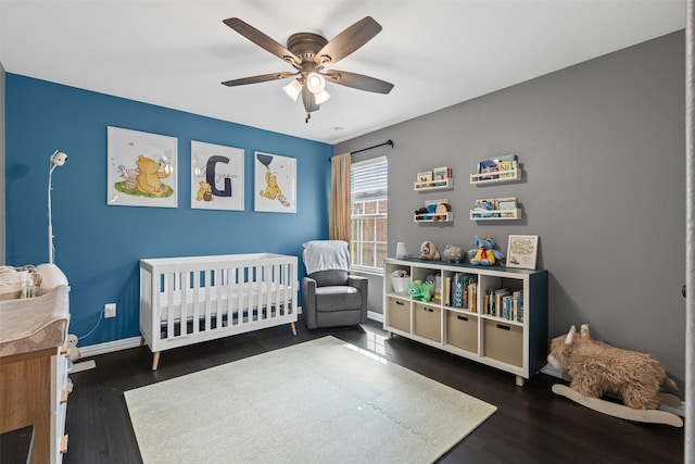 2104 Shane Ave, Fort Worth, TX 76134 - bedroom with wood finished floors, baseboards, a crib, and a ceiling fan