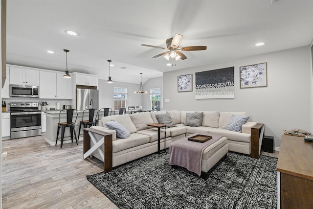 2104 Shane Ave, Fort Worth, TX 76134 - living area featuring a ceiling fan, recessed lighting, light wood-style floors, and baseboards